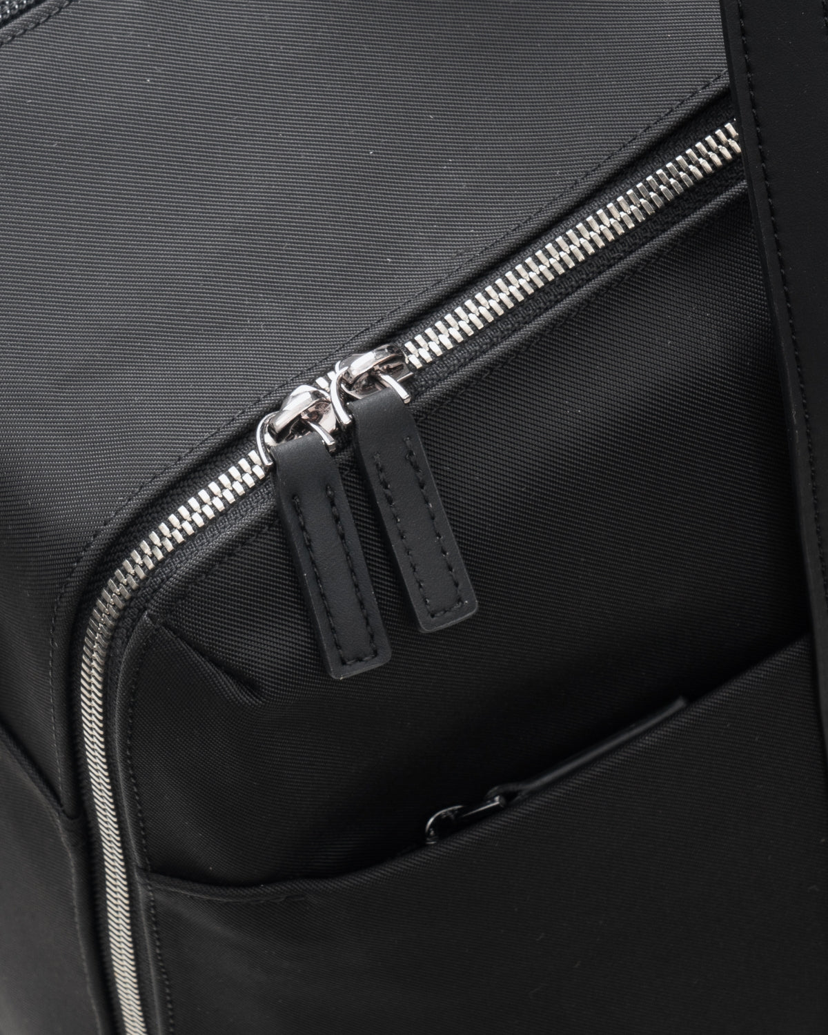 Close-up of durable dual zippers and premium fabric on LEVEL8 CITYGO Weekender Bag